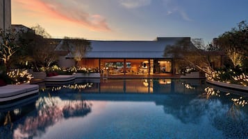 Outdoor pool, open 7:00 AM to 9:00 PM, pool umbrellas, pool loungers