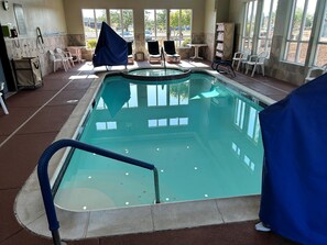 Indoor pool, open 9:00 AM to 10:00 PM, pool loungers
