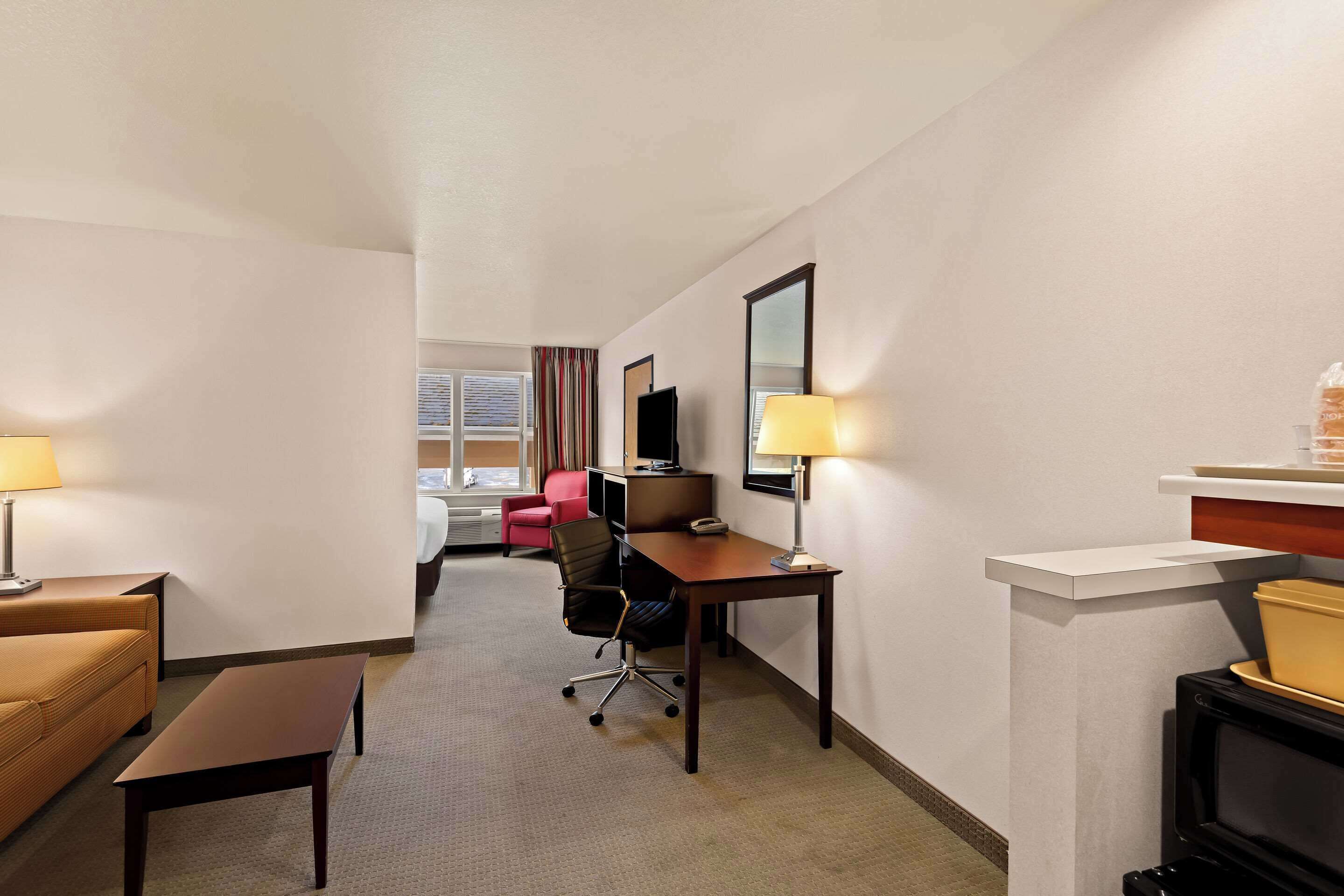 suite, 1 king bed, non smoking | desk, laptop workspace, blackout curtains, iron/ironing board