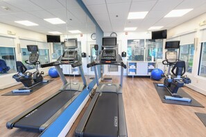 A gym with treadmills, exercise balls, and mirrors. - Holiday Inn Express Hotel & Suites Richwood-Cincinnati South by IHG (Walton)