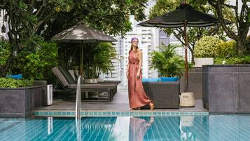 Outdoor pool, open 6:00 AM to 8:00 PM, pool umbrellas, pool loungers