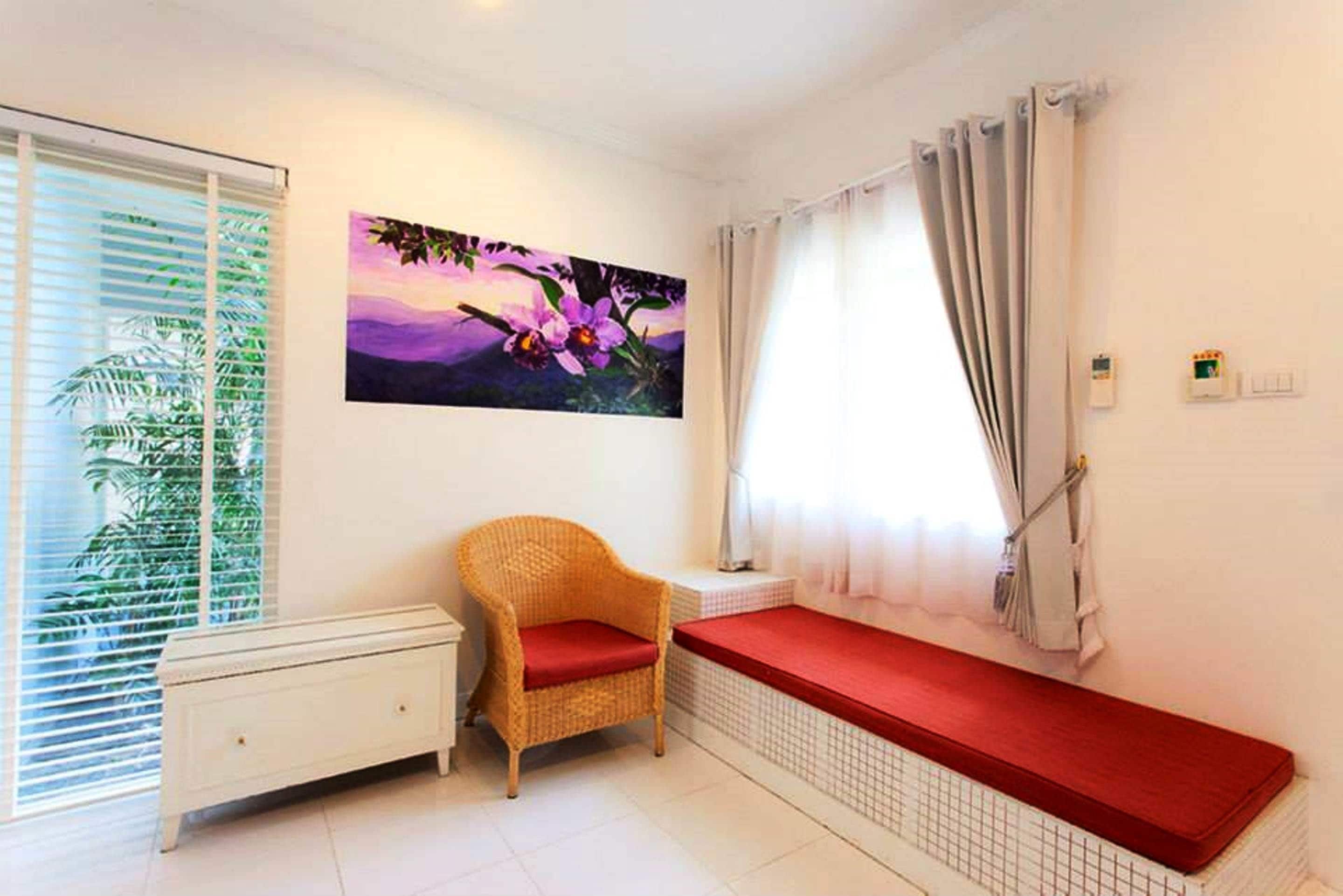 deluxe villa, garden view | living area | 49-inch tv with satellite channels, fireplace, pay films