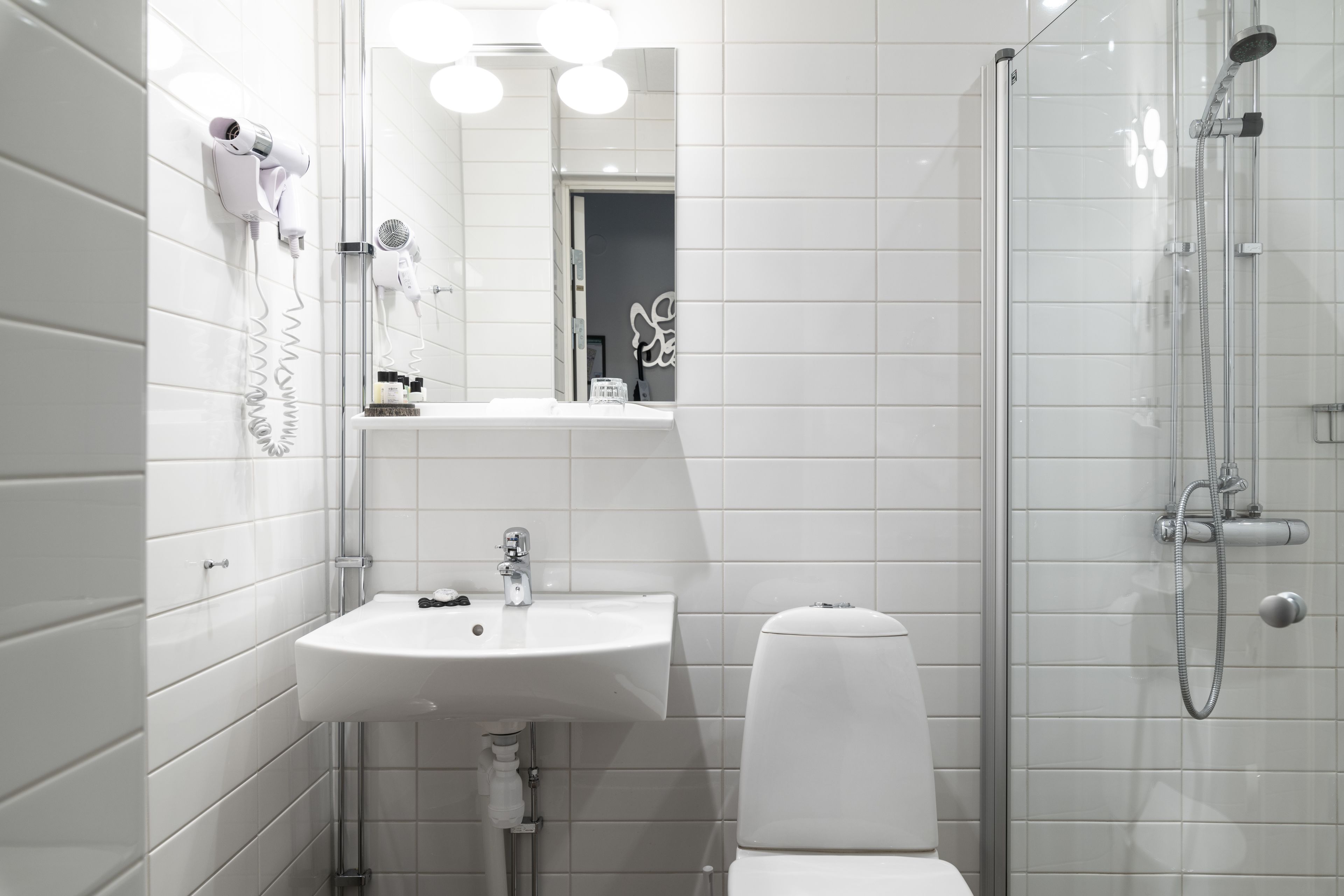 designer toiletries, hair dryer, bathrobes, towels