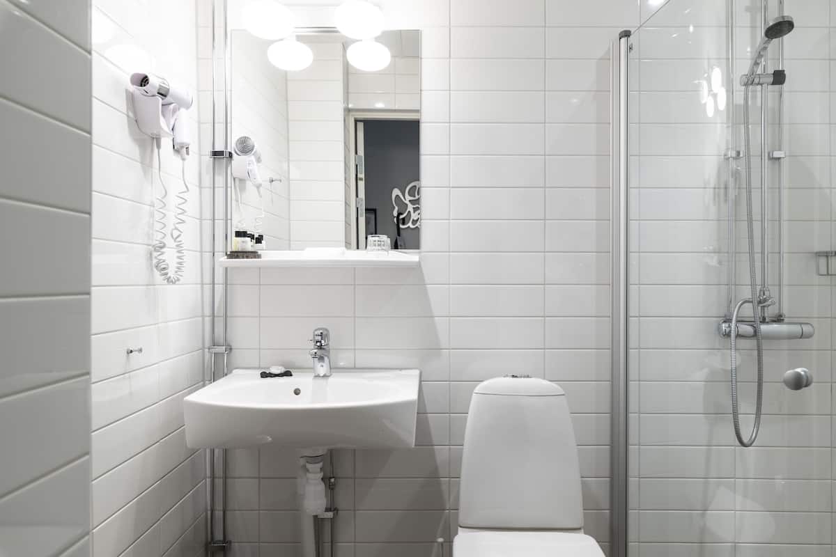 designer toiletries, hair dryer, bathrobes, towels