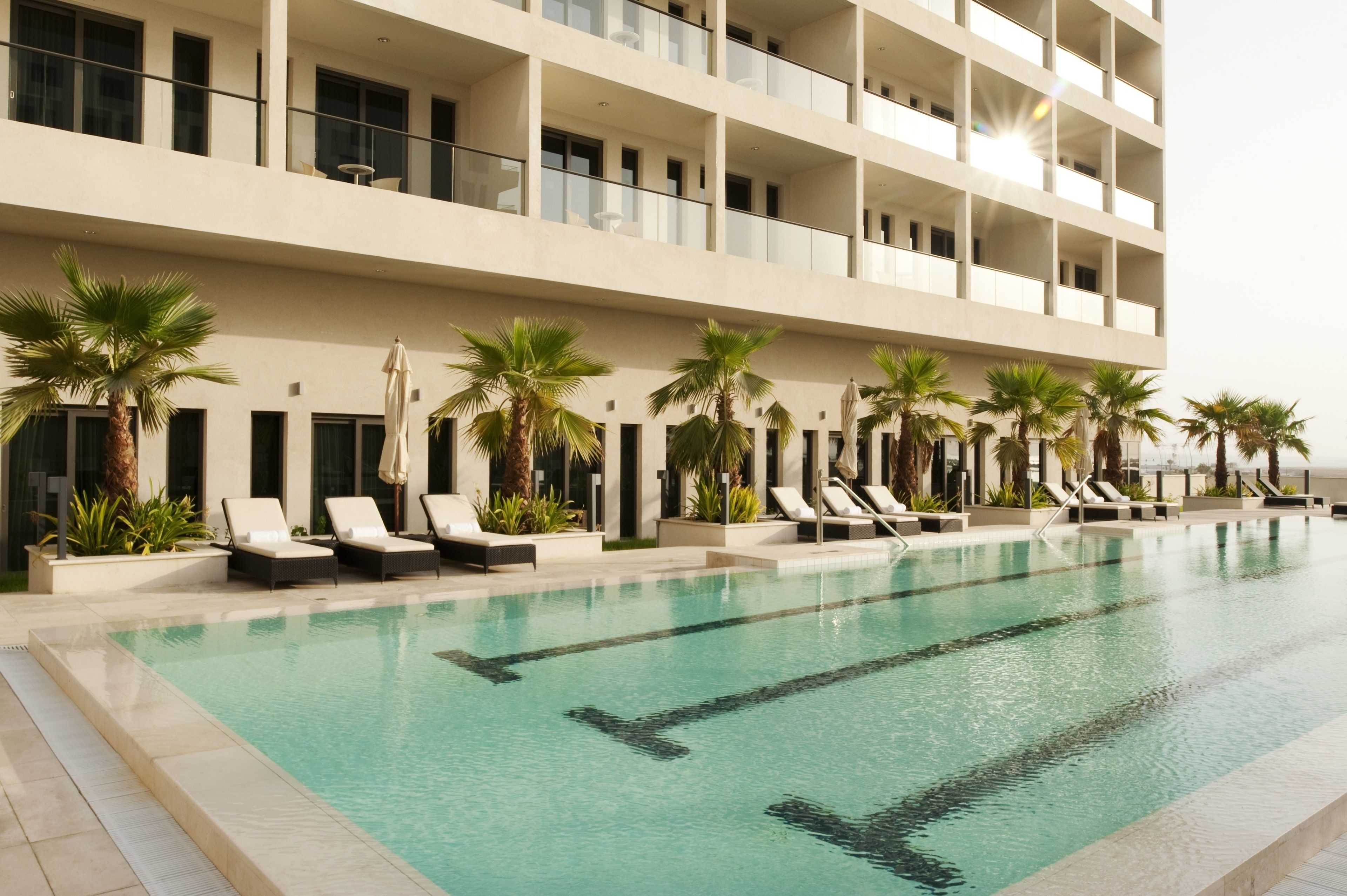 outdoor pool, open 7:00 am to 8:00 pm, pool loungers