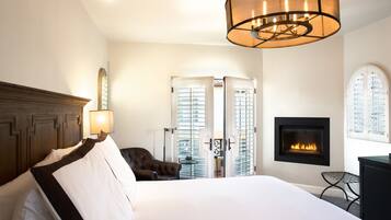 Deluxe Room, 1 King Bed, Fireplace, Courtyard View | Frette Italian sheets, premium bedding, down comforters, in-room safe