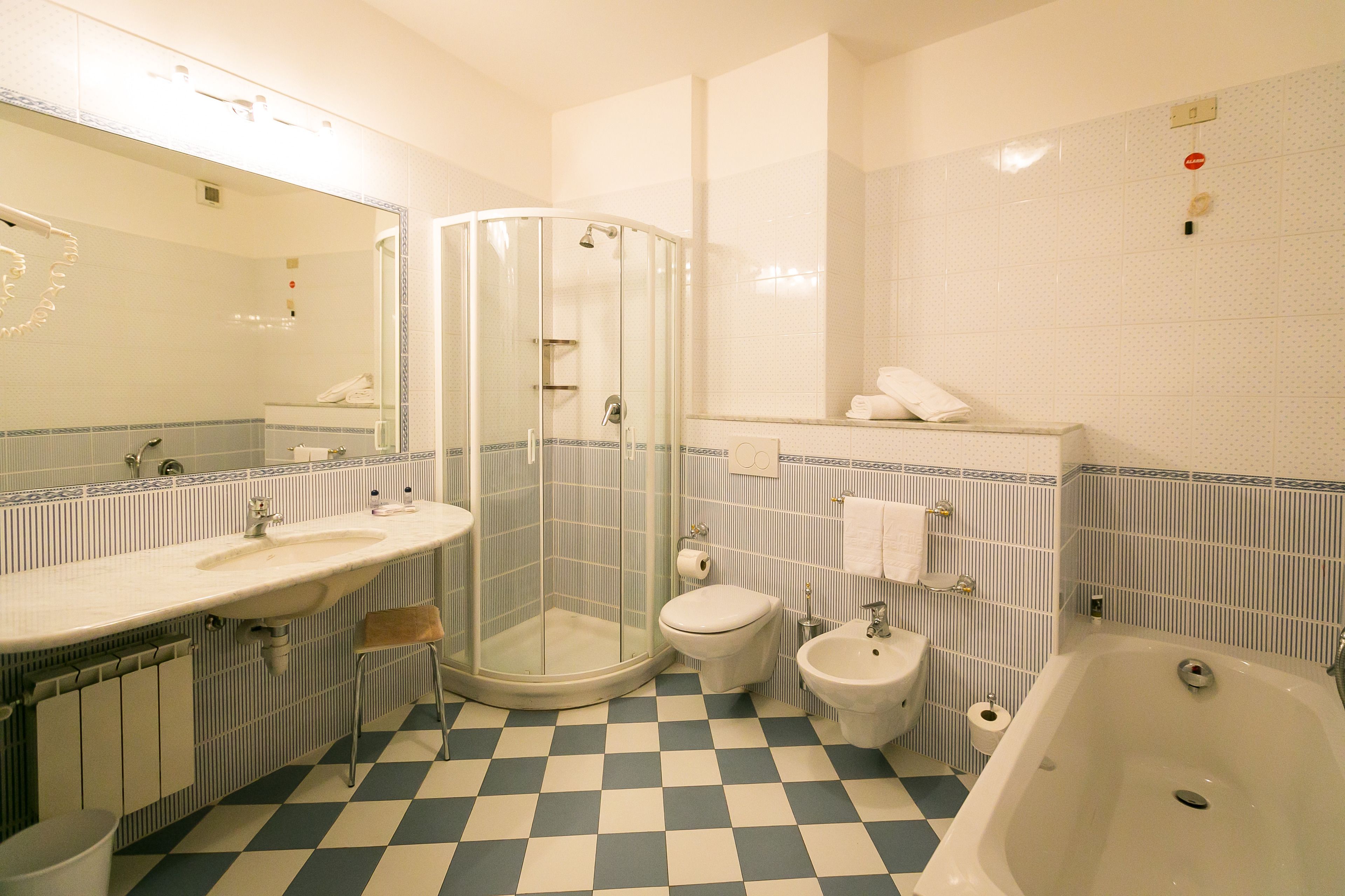 triple room, lake view | bathroom | combined shower/bathtub, free toiletries, hair dryer, slippers