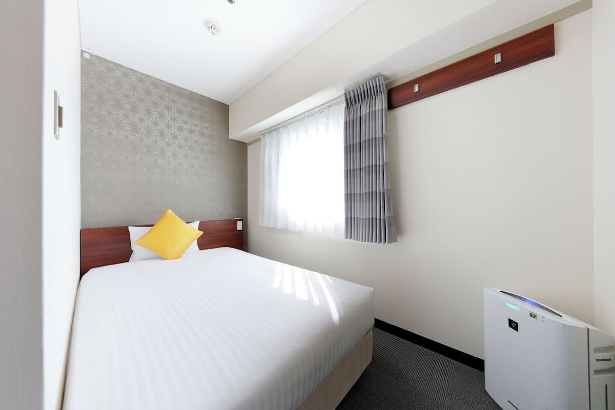 Economy Single Room | Memory-foam beds, desk, blackout curtains, iron/ironing board