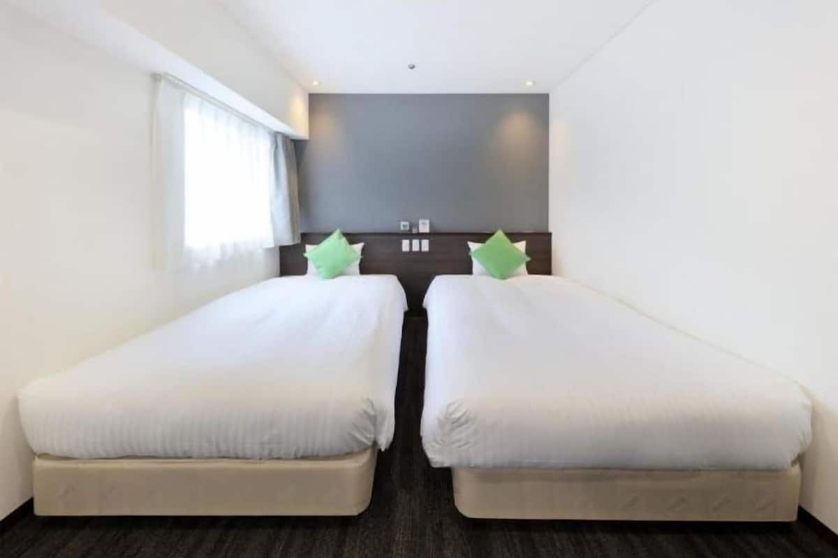 Memory-foam beds, desk, blackout curtains, iron/ironing board