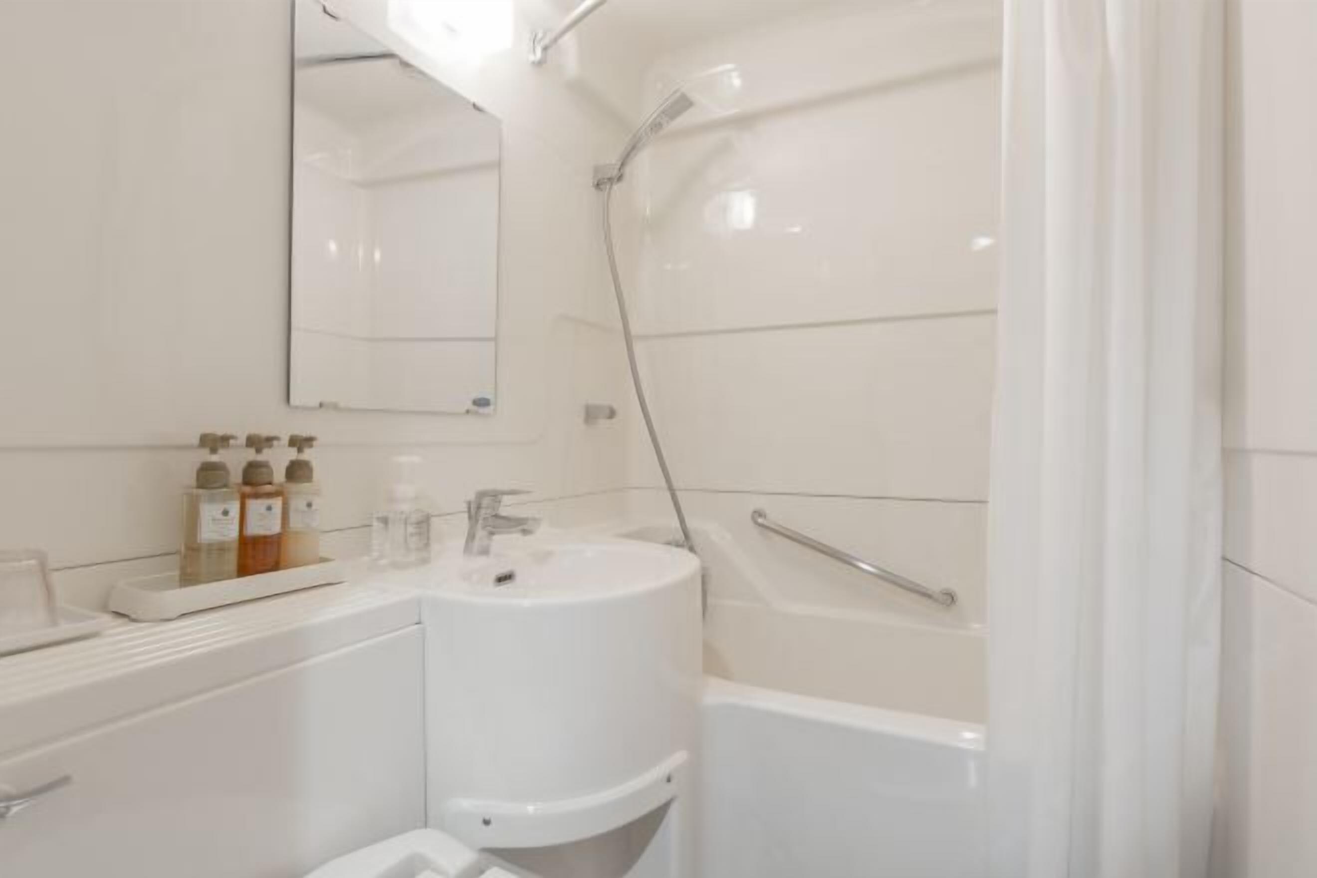 Combined shower/bathtub, free toiletries, hair dryer, bathrobes