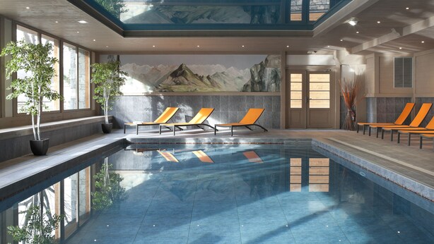 Une vaste piscine intérieure aux carreaux bleu clair, dotée d’espaces de détente baignés de lumière et ornée d’une fresque représentant des montagnes.