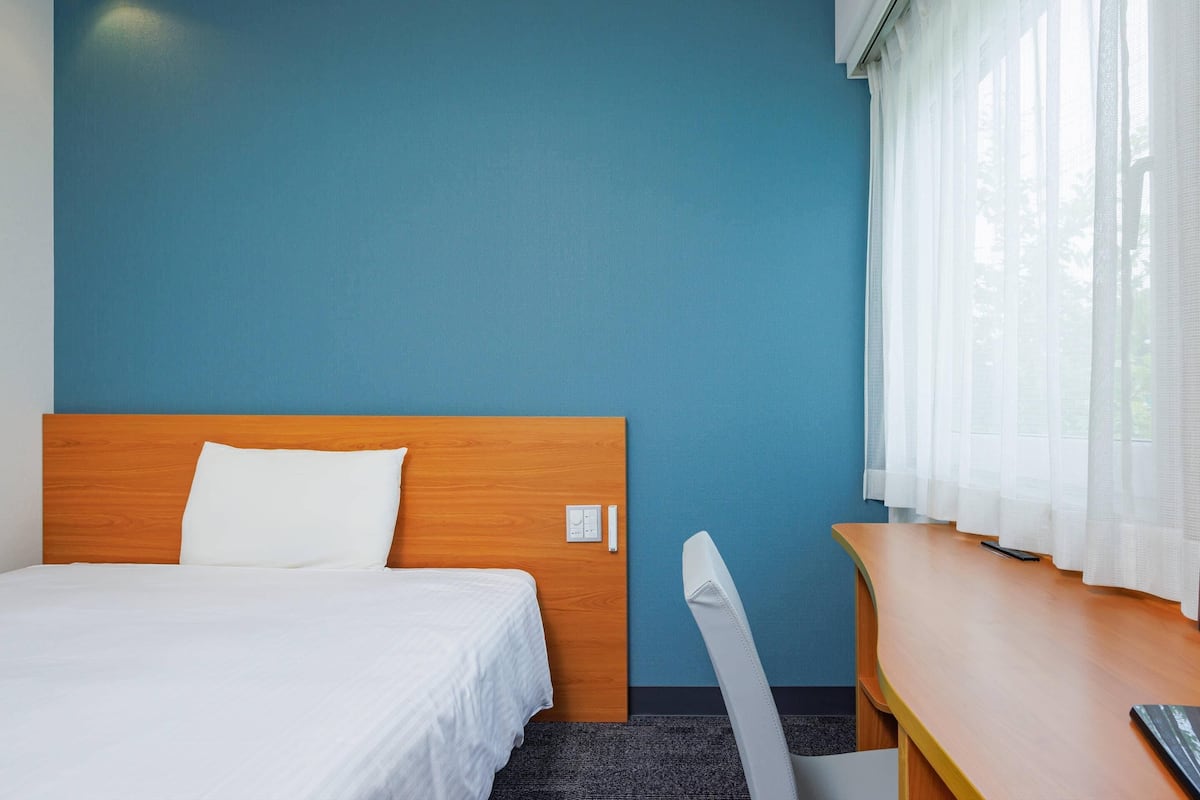 Down comforters, desk, laptop workspace, blackout drapes