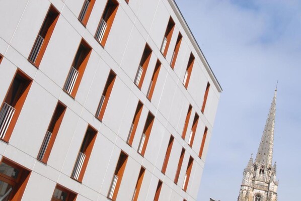 Stunning building with a unique architectural style, featuring rectangular windows and a striking facade.