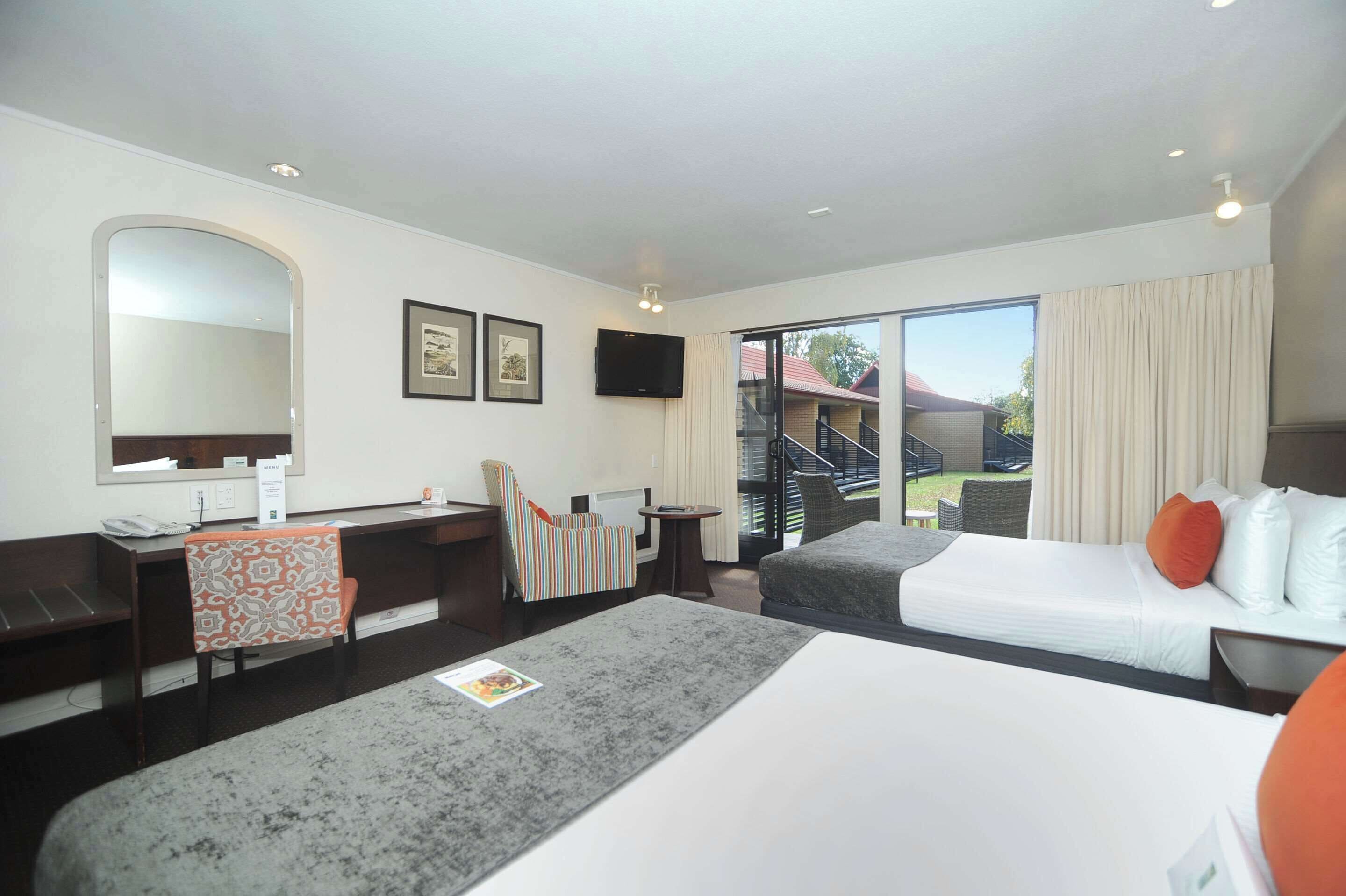 deluxe room, 2 queen beds, non smoking | premium bedding, desk, laptop workspace, blackout curtains