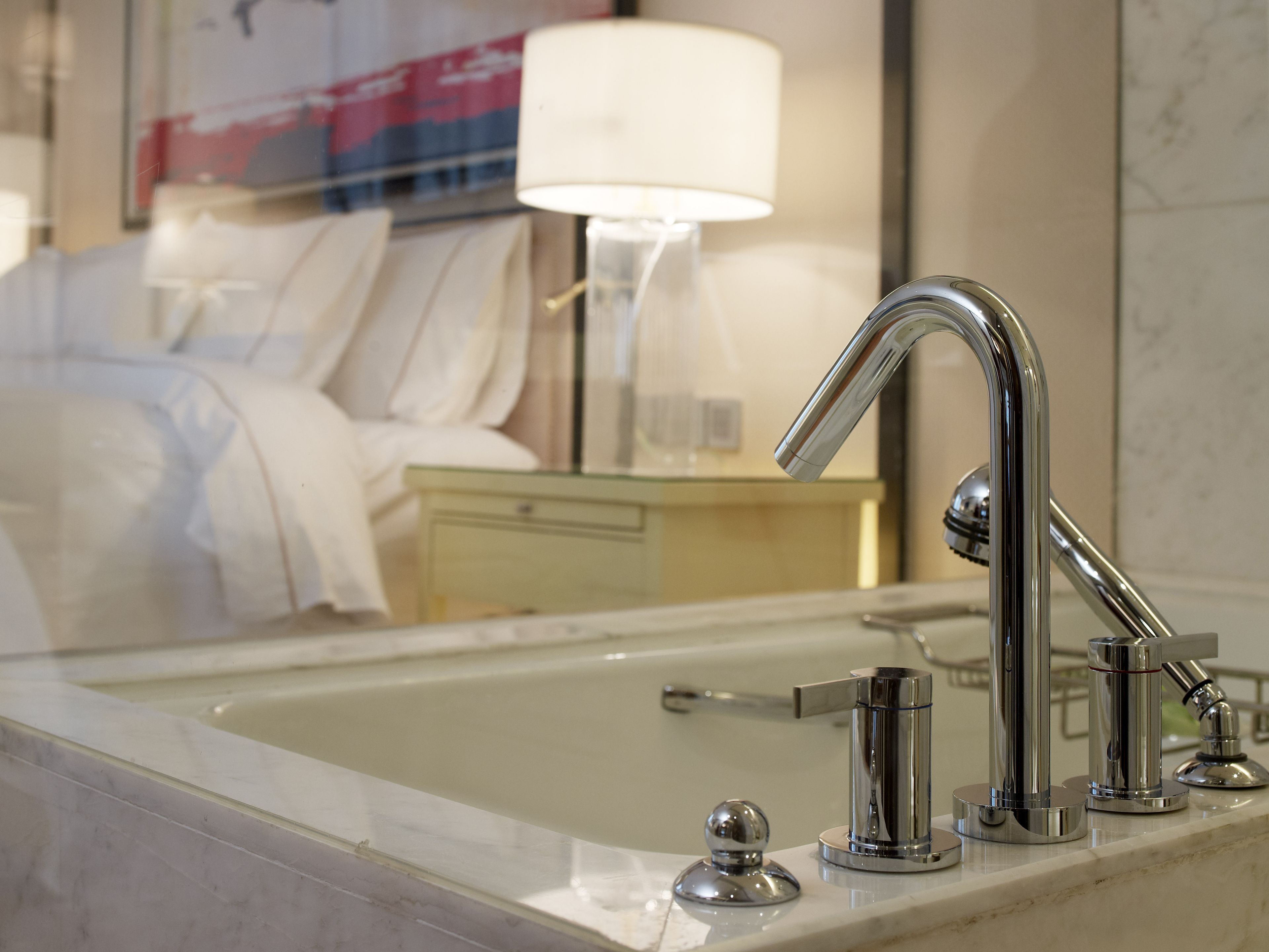 separate bathtub and shower, rainfall showerhead, designer toiletries