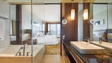Separate tub and shower, rainfall showerhead, designer toiletries