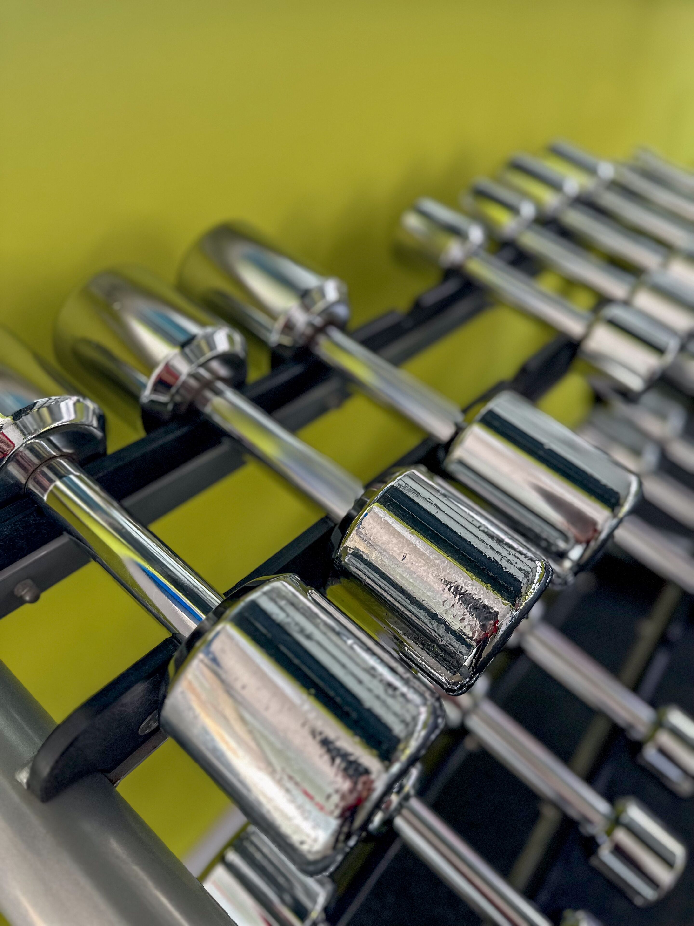 A close-up of a metallic object with a reflective surface, possibly a part of a mechanical device or machinery.
