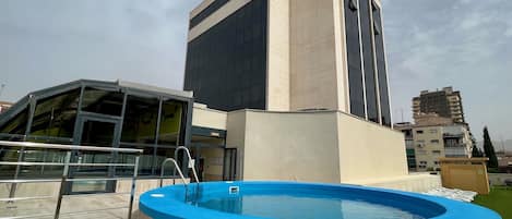 Seasonal outdoor pool, open 10:30 AM to 8:30 PM, pool loungers