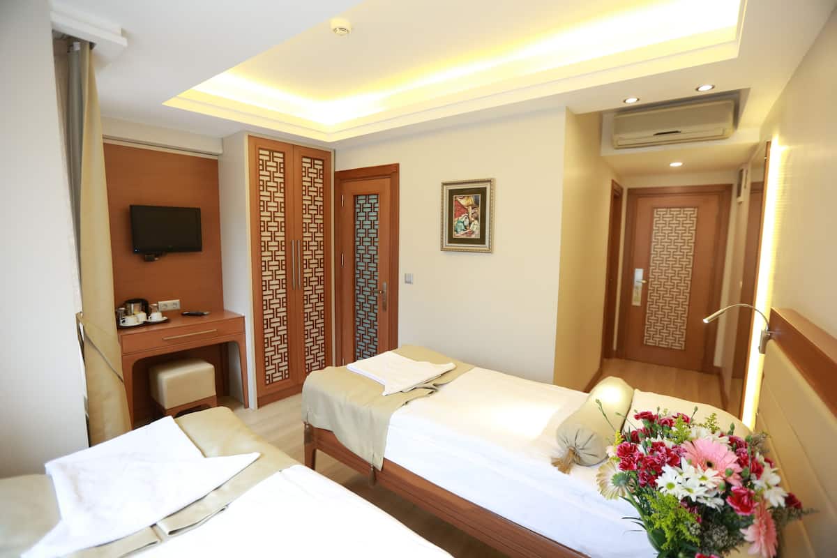 Family Room, 2 Bedrooms | Free minibar items, in-room safe, soundproofing, iron/ironing board