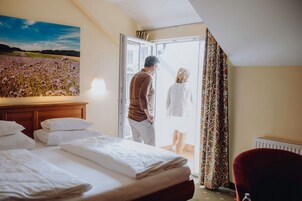 Double Room | Minibar, in-room safe, individually decorated, desk