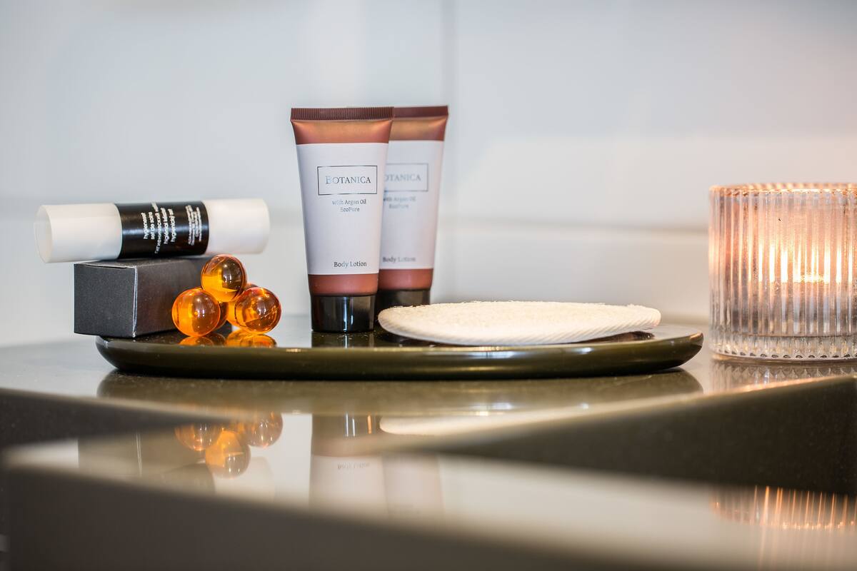 deep-soaking bathtub, rainfall showerhead, free toiletries, hair dryer