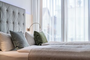 Suite Deluxe | Ropa de cama de alta calidad y minibar 