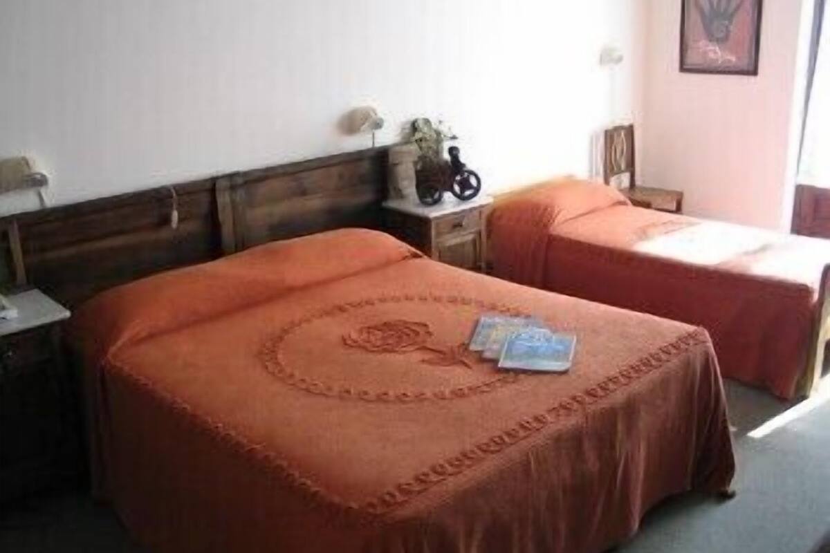 Triple Room | Desk, blackout drapes, cribs (surcharge), rollaway beds (surcharge)