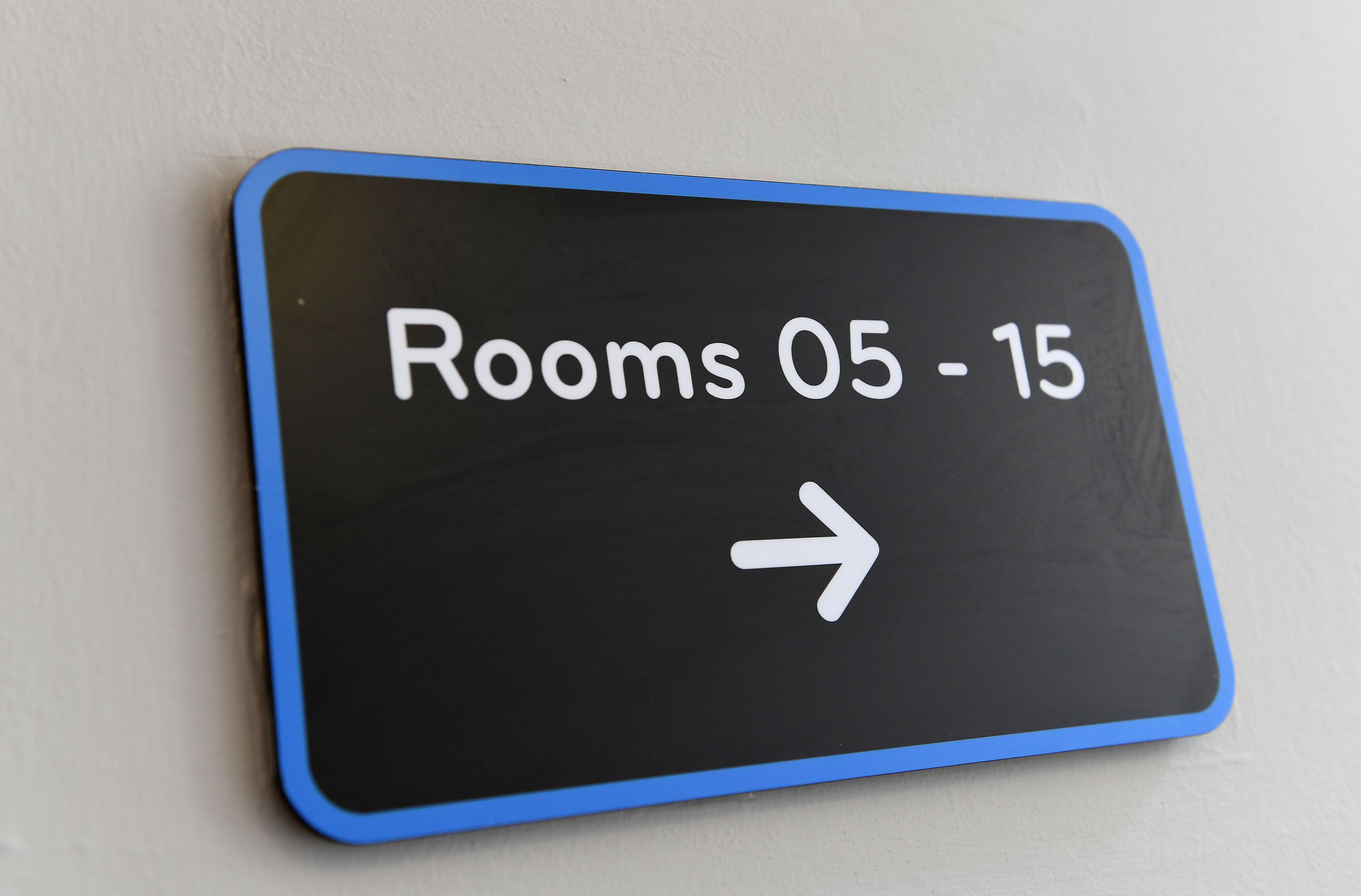 A sign indicating Rooms 05 - 15.