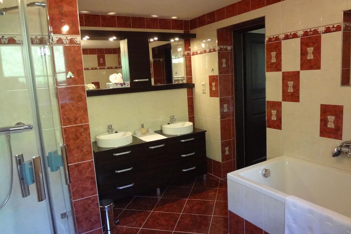 separate bathtub and shower, deep-soaking bathtub, hair dryer, slippers