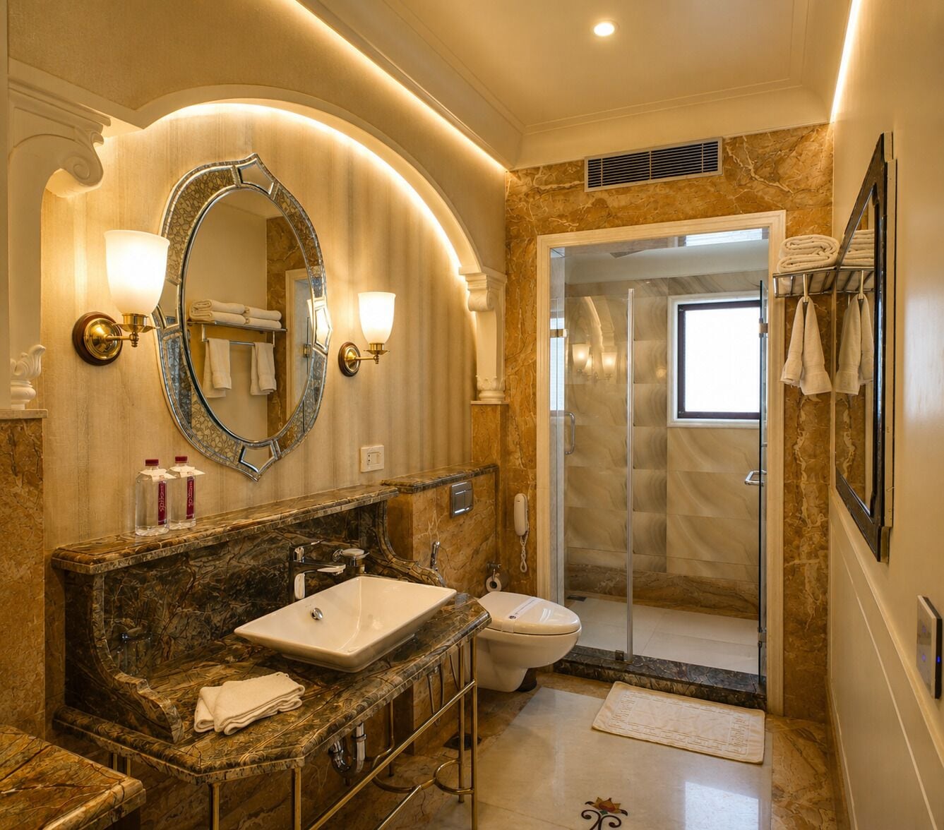 A luxurious bathroom with a marble vanity, a large mirror, a shower, and a glass door leading to the shower.