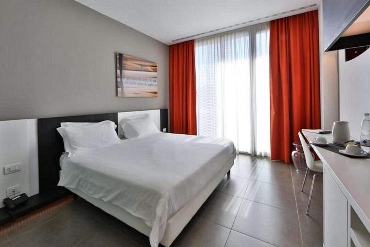 Premium bedding, down comforters, minibar, in-room safe