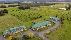 A large agricultural facility with multiple greenhouses and fields. - Talga Estate (Lovedale)