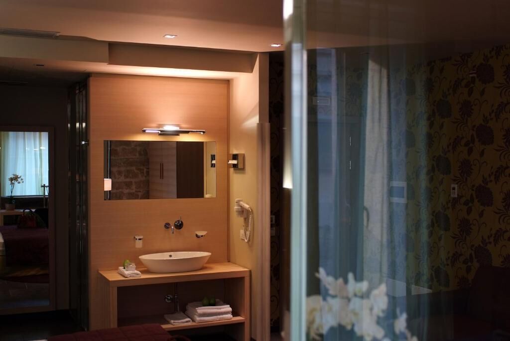 junior studio suite | bathroom | rainfall showerhead, hair dryer, bidet, towels