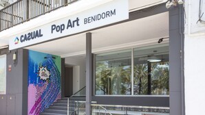 A hotel named Casual Pop Art Benidorm with a colorful mural on the facade.