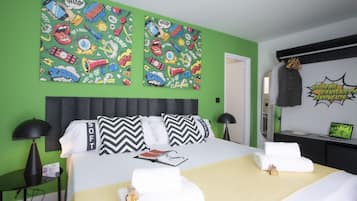 Relax in a stylish room with a large bed, wall-mounted TV, and modern amenities.