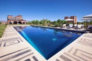 Outdoor pool, pool umbrellas, sun loungers