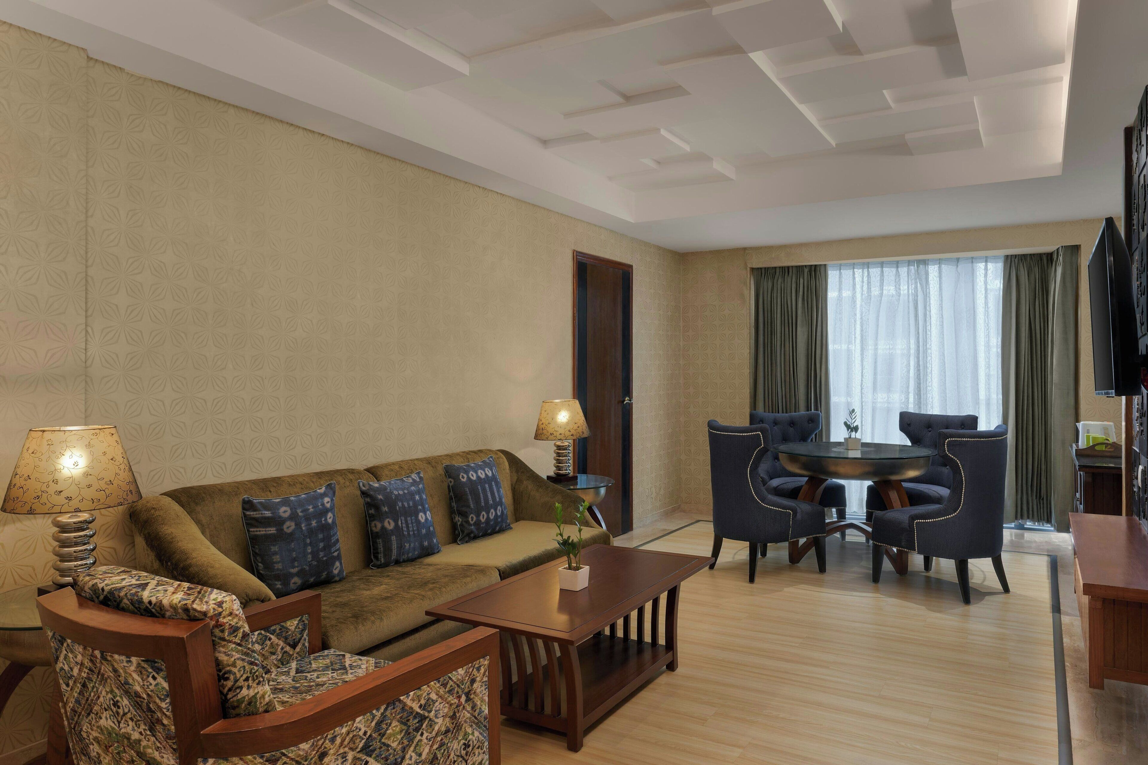 Classic Suite, 1 King Bed, City View | Living room | 32-inch LCD TV with digital channels, TV
