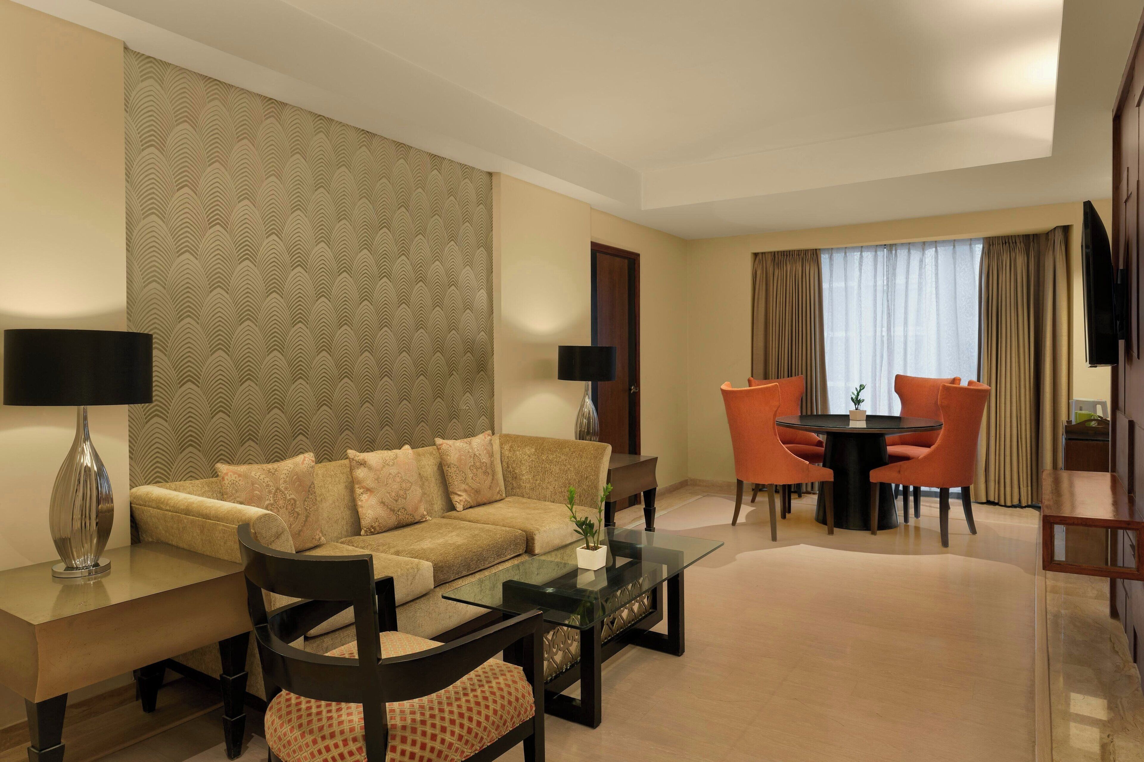Suite, 1 King Bed, City View | Living room | 32-inch LCD TV with digital channels, TV