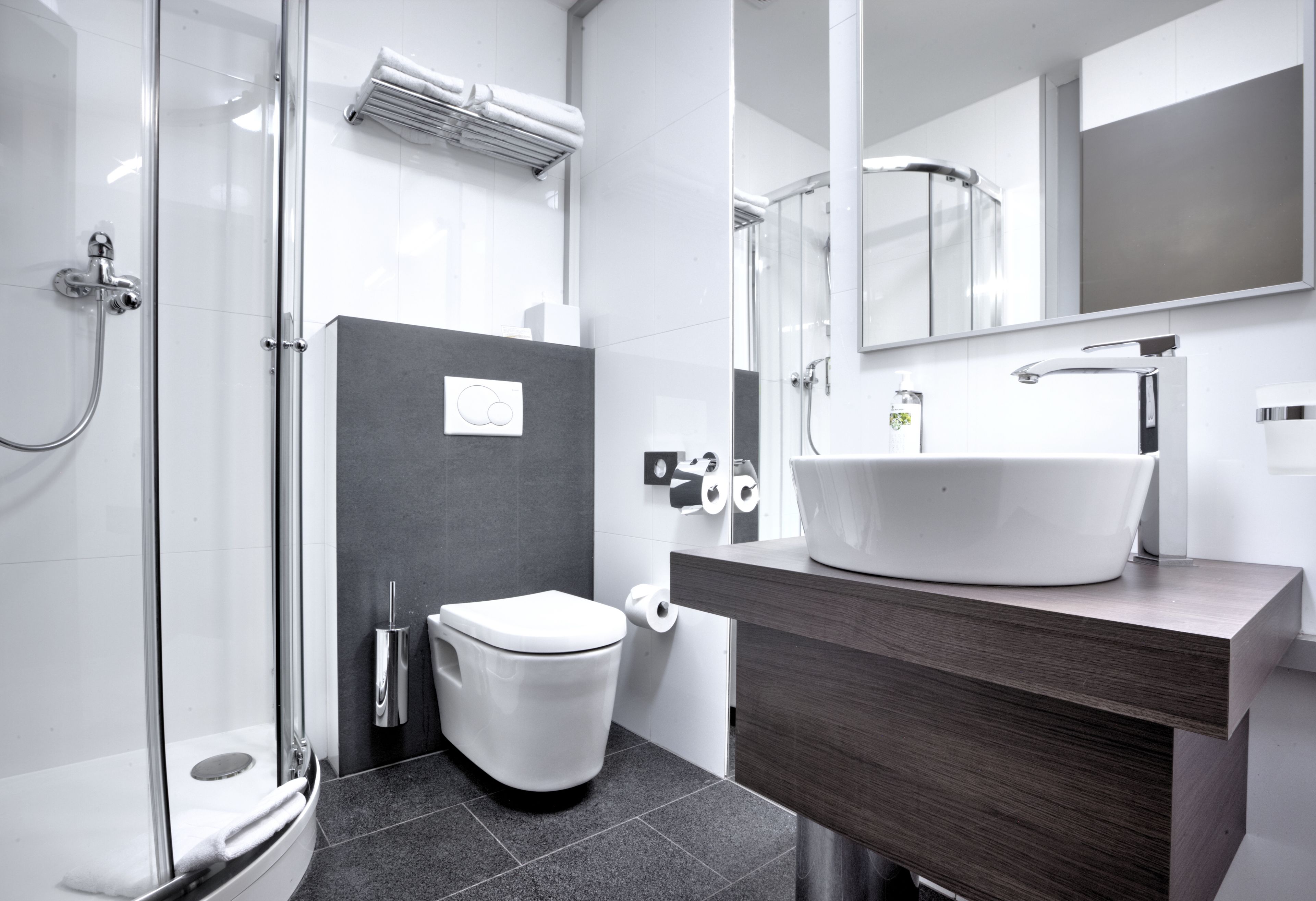 designer toiletries, hair dryer, towels