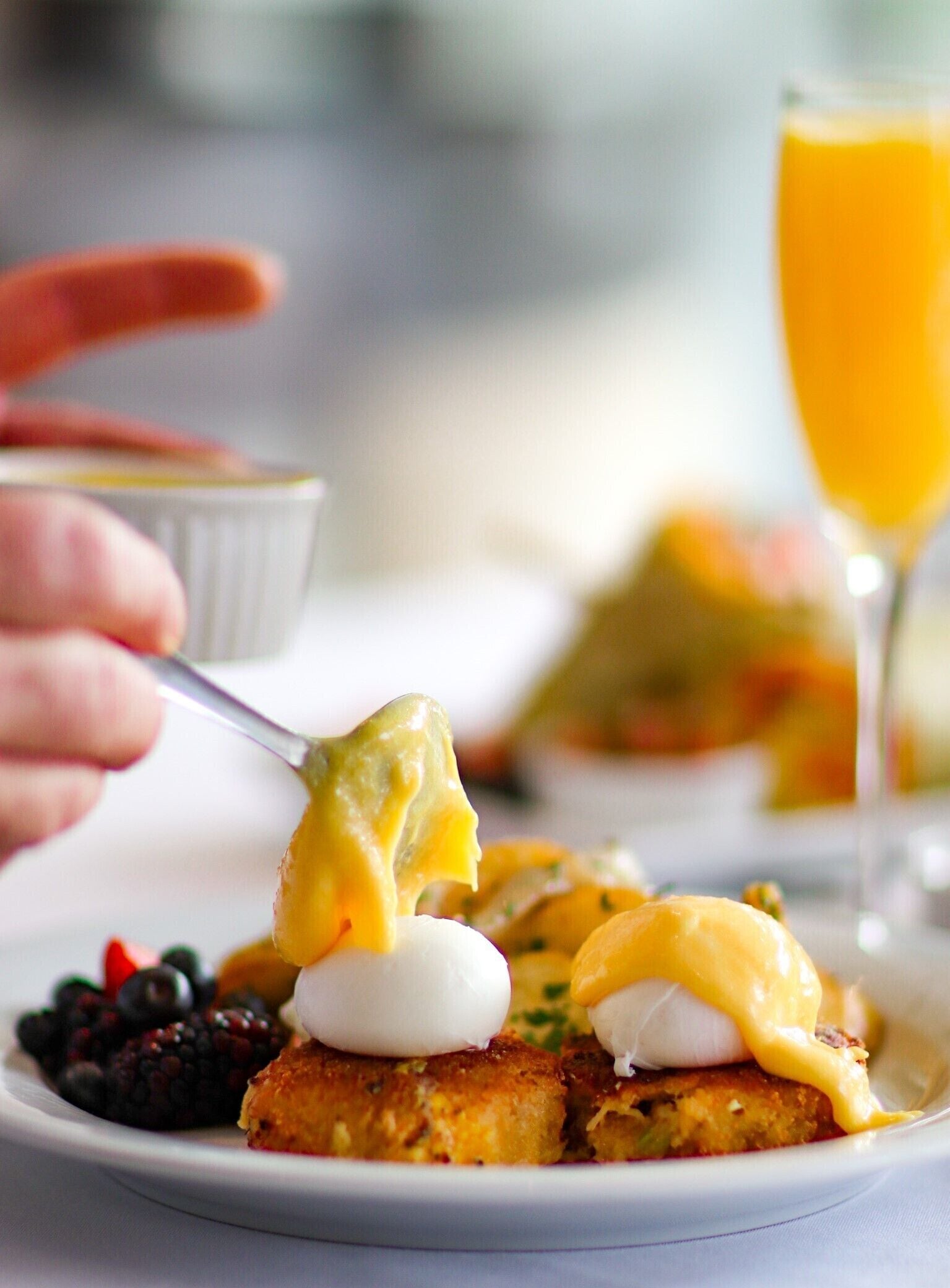 A breakfast plate with eggs, toast, and berries.