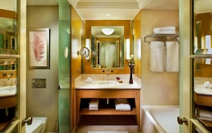 A bathroom with a sink, mirror, and towel rack. - Kempinski Nile Hotel Cairo (Cairo)