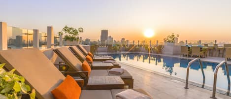 Outdoor pool, open 7:00 AM to 5:00 PM, pool umbrellas, sun loungers