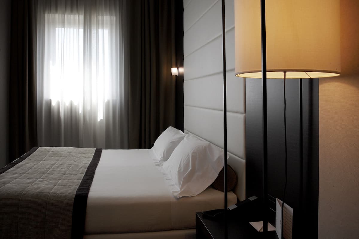classic room | 1 bedroom, premium bedding, minibar, in-room safe