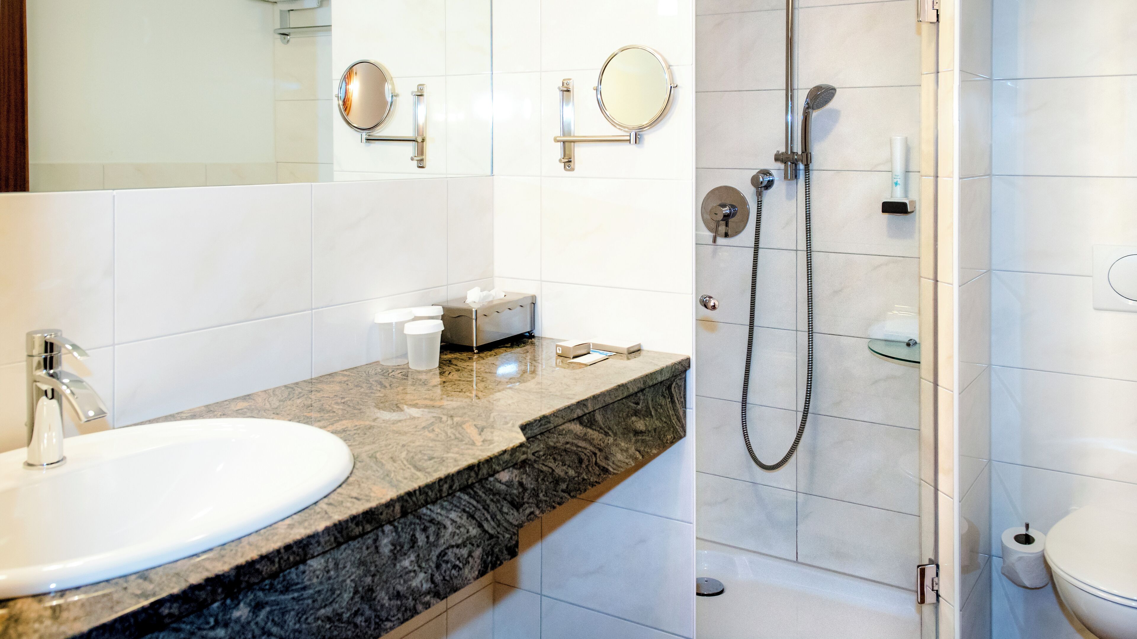 classic triple room, multiple beds | bathroom | eco-friendly toiletries, hair dryer, bathrobes, slippers