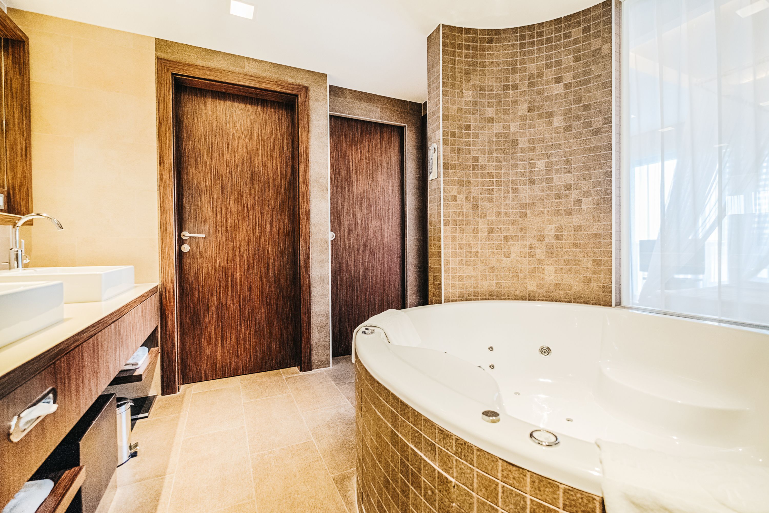 junior suite, lake view | bathroom | hair dryer, bathrobes, towels, soap