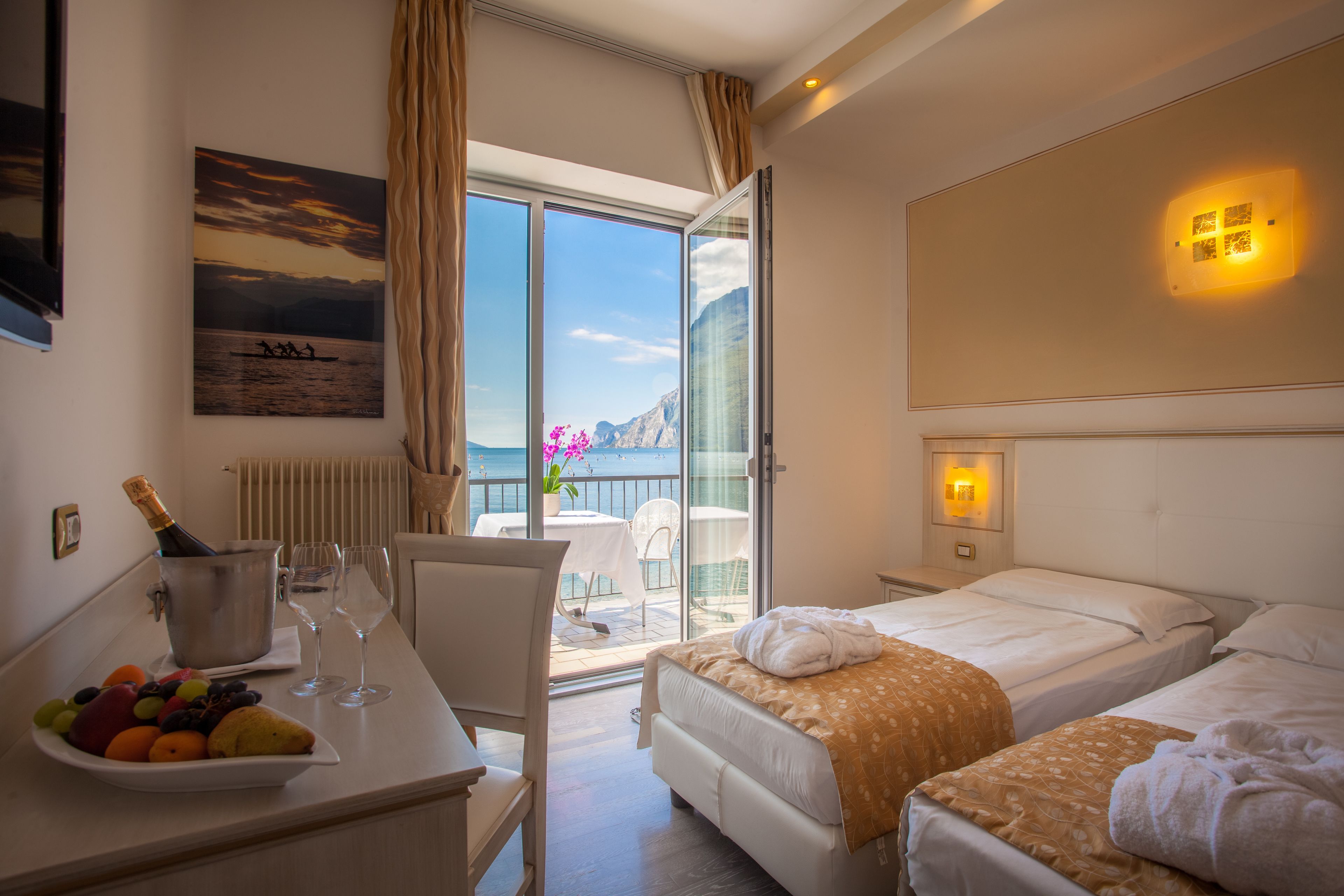 deluxe room, lake view | free minibar items, in-room safe, desk, free cots/infant beds