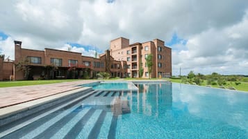 Indoor pool, outdoor pool, pool umbrellas