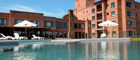 Indoor pool, outdoor pool, pool umbrellas