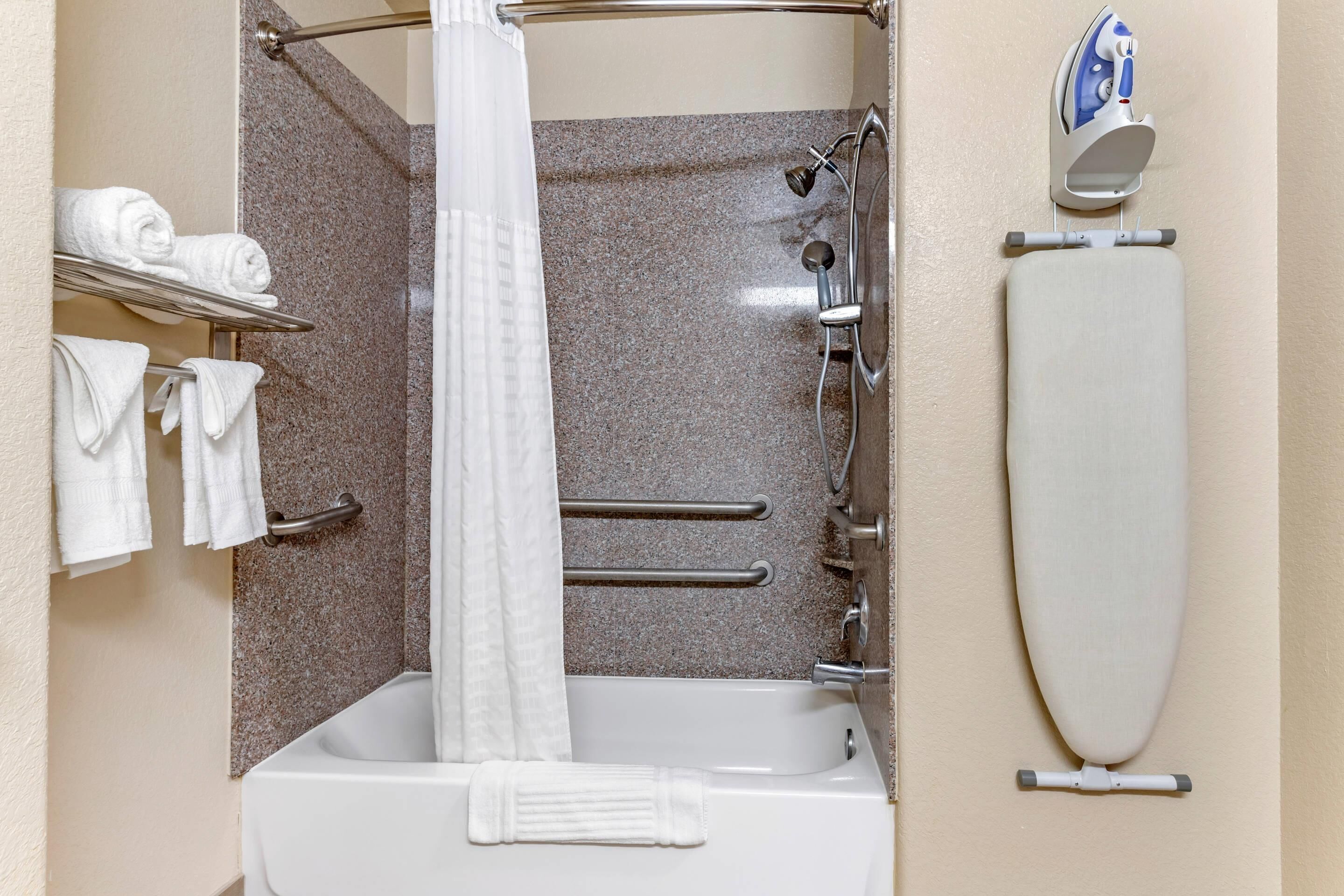 premium bedding, desk, blackout curtains, iron/ironing board