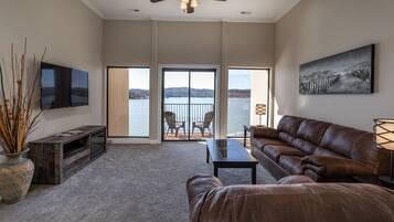 Exclusive Condo, 1 Bedroom, Kitchenette, Lake View | Living area | Flat-screen TV, fireplace